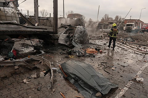 A Ukrainian rescuer works at the site of an air attack in Kyiv, amid the Russian invasion of Ukraine. 