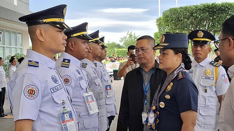 Bataan Provincial Police Director (BPPO) Provincial Director Police Col. Marites A. Salvadora checks the uniform of the security personnel of the SM City Bataan during the annual General Formation and Inspection of Troops at the parking area of the mall in Balanga City, Bataan on November 25, 2025. 