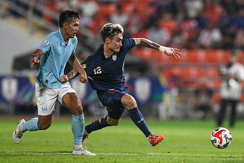 CHANPOLIN Orn of Cambodia (left) fights for the ball with Nicholas Mickelson of Thailand during their ASEAN Electric Cup match. The two sides will not get to compete against each other in the coming 33rd Southeast Asian Games after the Cambodians pulled out due to ‘safety’ reasons. 