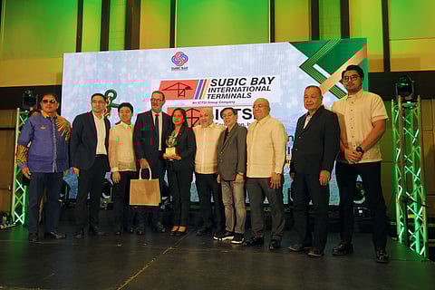 Subic Bay International Terminal Corporation (SBITC) Executive Director Philippe Baudry and Health, Safety, and Environment (HSE) Manager Michelle Madriaga receive the Green Anchor Award from the SBMA Board of Directors at the ACEA Beach Resort in Subic Bay Freeport Zone on November 24, 2025.