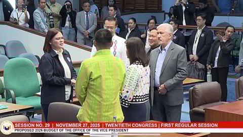 Vice President Sara Duterte talks to Senators after the swift deliberation of the proposed P889 million budget of the Office of the Vice President on Thursday.