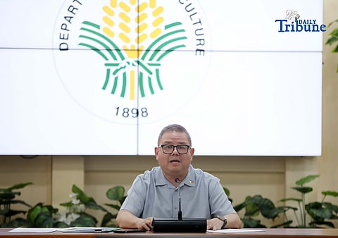 Agriculture Secretary Francisco Tiu Laurel Jr. shows a photocopy of his text exchange with former congressman Zaldy Co — along with a confidential report for Congress — in response to Co’s allegations of “price and import manipulation” of sugar, onion, rice, and fish. Tiu also denied claims that Co influenced the reduction of rice tariffs from 35 percent to 15 percent. The secretary refuted all accusations during a press conference at the Department of Agriculture office in Quezon City on Thursday. Photo by Analy Labor