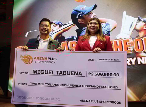 MIGUEL Tabuena gets a P2.5-million cash prize from DigiPlus Interactive Corp. vice president of investor relations and corporate communications Celeste Jovenir for winning the title in the International Series Philippines presented by BingoPlus last month at the Sta. Elena Golf and Country Club.