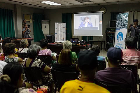 Relatives of victims of former president Rodrigo Duterte’s war on drugs react as the International Criminal Court rejects Duterte’s appeal for interim release, during a live-stream watch party in Manila on Friday, 28 November 2025.
