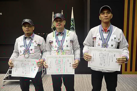 WINNERS from MMPC proudly hold their certificates after earning two golds and one silver at the Global Monozukuri Skill Competition in Japan. Shown are (from left) Mark Bagnes wins Silver under CO2 Arc Welding Category, Nelson Ojoy wins Gold under Forklift Pallet Handling Operation Category, and Sherwin Recaido wins Gold under Metal Repair and Hand Skill Finishing Category.