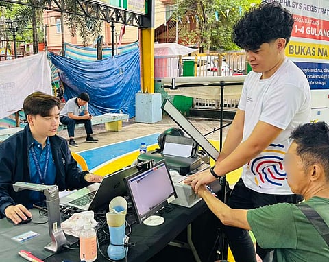 PSA personnel facilitate the National ID registration of a resident in Barangay Tugatog, Malabon City