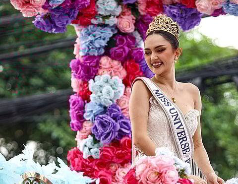 Miss Universe third runner-up Athisa Manalo waves to a crowd of supporters during her homecoming parade outside the Manila City Hall on Tuesday, 2 December 2025.
