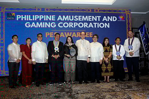 PAGCOR executives led by President and COO Wilma Eisma (5 th from left) receive a plaque of recognition from the Governance Commission for GOCCs (GCG) for being one of the top-performing GOCCs based on its 2024 Performance Evaluation Scorecard. With them in photo are GCG Chairperson Atty. Marius P. Corpus (6 th from left) former Senator Franklin Drilon, and other GCG officials.