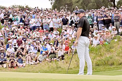 RORY McIlroy watches his putt during the Australian Open at Royal Melbourne Golf Club in Melbourne on 5 December.