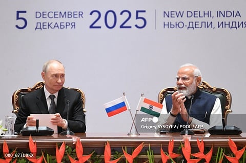 IN this pool photograph distributed by the Russian state agency Sputnik, Russia's President Vladimir Putin and India's Prime Minister Narendra Modi attend a plenary session of the India-Russia trade forum in New Delhi on December 5, 2025.