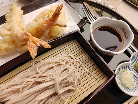 COLD buckwheat noodles with assorted tempura, a classic pairing with sake.