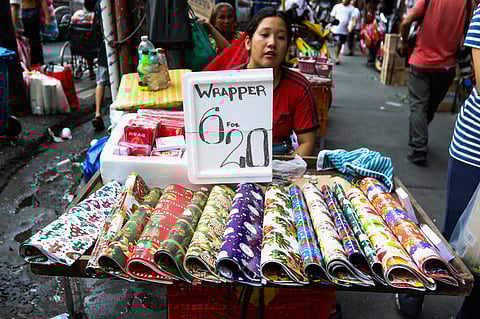 HOLIDAY-themed gift wrappers are being sold along a sidewalk in Binondo, Manila as the country gears up for the holiday.season. 