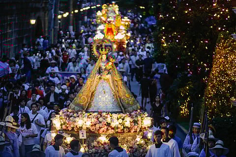 HUNDREDS of devotees gather and join the Grand Marian Procession inside the ‘Walled City,’ Intramuros, Manila, on the eve of the Feast of the Immaculate Conception, Sunday. Images of the Virgin Mother from various churches in Metro Manila and nearby provinces join the procession in honor of their Patroness.
