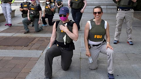 FBI agents fired for kneeling during racial justice protest file suit