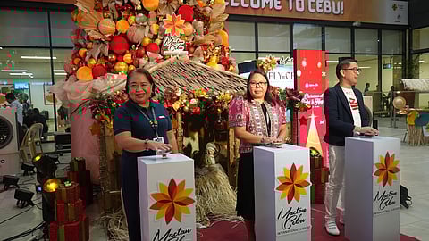 LIGHT it up The tree lighting ceremony was led by (from left) MCIAA Public Affairs head Mary Ann Dimabayao, ACAC head of Strategy and Communications Christine Villanueva, and Lapu-Lapu City chief tourism officer Garry Lao. 