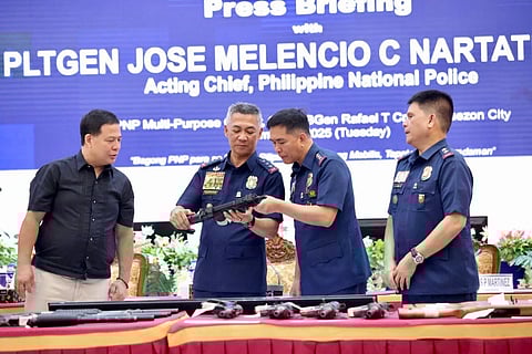 THE Philippine National Police, led by Acting Chief PLtGen. Jose Melencio C. Nartatez Jr. (second from left), accepts the voluntary surrender of 25 high-powered firearms, 70 rounds of ammunition, 15 explosives and four magazine from Jesus P. Martinez of San Pedro Village, Buhangin, Davao City.