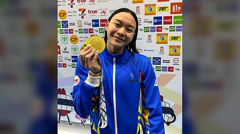 KAYLA Sanchez beams with pride after ruling the 100-meter backstroke — her third gold medal — in the 33rd SEA Games in Thailand.