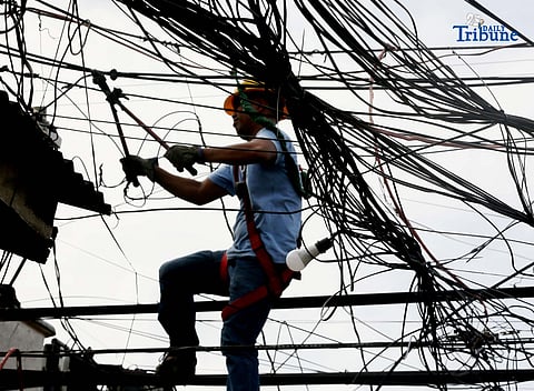 (December 13 2025) On Saturday December 13 2025, Miescor workers were seen removing the damaged wire caused by the 5th alarm fire that hit at  Barangay Pleasant Hills in Mandaluyong City on Friday night December 12 2025. Photo/Analy Labor
