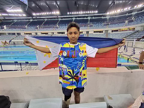 RIC Daniel Pasadilla celebrates after winning the gold medal in the boys 12-16 200-meter individual medley SM 4-14 multi-class event of the Asian Youth Para Games at the Hamdan Sports Complex in Dubai on Friday.