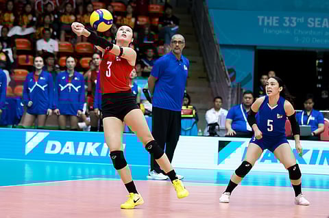 VANIE Gandler lends a hand in Alas Women’s 25-13, 25-8, 25-18 victory over Singapore on Friday to reach the semifinal round for the fifth straight time in the 33rd SEA Games in Thailand.