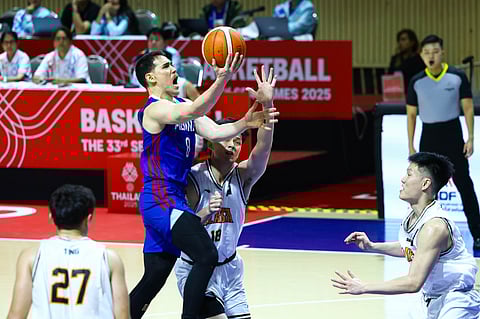 (FILE) ROBERT Bolick drives his way to 17 points in Gilas’ 83-58 victory over Malaysia on Sunday in the 33rd SEA Games men’s basketball competitions in Thailand.