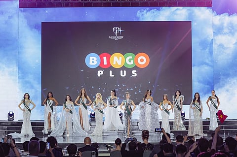 Miss Earth 2025 candidates in their shiny silver evening gowns