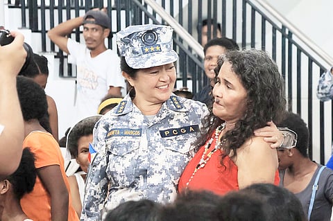 FIRST Lady Liza Araneta-Marcos, donning her Coast Guard uniform as Auxiliary Vice Admiral, presides over the provision of humanitarian assistance to about 300 aetas in Bataan recently.