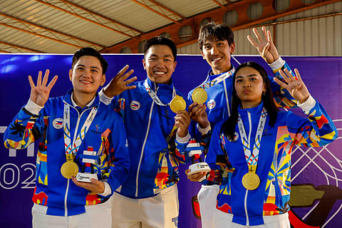 ROLLY Nathaniel Tecson, Edcel John Gino, Genesis Pible and Erin Mattea Micor smile after clinching four gold medals in the practical shooting competition of the 33rd Southeast Asian Games.