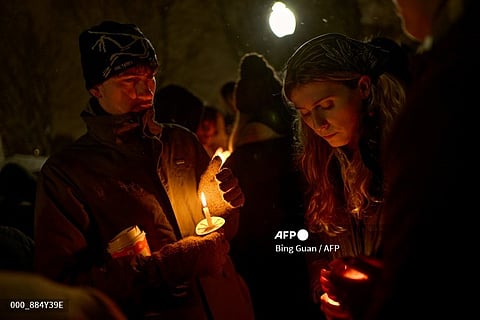 US-SHOOTING-BROWN-CRIME
Brown University students participate in a candlelight vigil the following day of a mass shooting on the campus of Brown University, in Providence, Rhode Island on December 14, 2025. US authorities on Sunday detained a person of interest in the mass shooting at Brown University that left two people dead and nine others wounded, the latest in a long line of school attacks nationwide.
