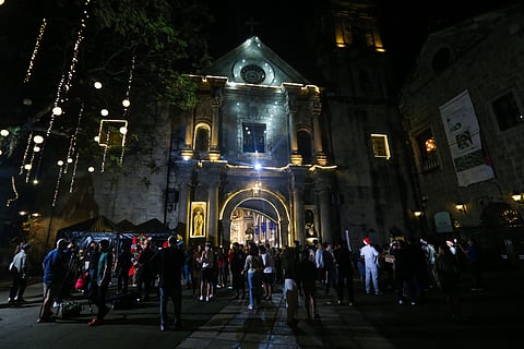 Catholic devotees flock to San Agustin Church to attend the first day of Simbang Gabi in Intramuros, Manila, on 16 December 2025. Churchgoers are then treated to a free hamburger and refreshments after the mass.