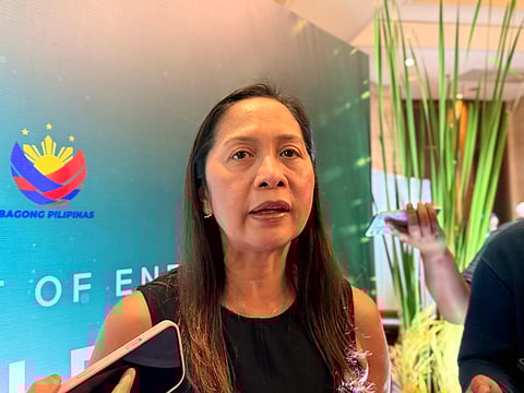 Energy Secretary Sharon S. Garin speaks to reporters before the signing of the $170-million geothermal de-risking facility. 