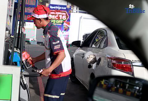 (December 16 2025) A gasoline attendant wearing a Santa Claus hat fills up vehicles of their customer at a gasoline station along EDSA in Cubao, Quezon City on Tuesday, December 16, 2025. Pump prices are set to adjust by oil companies starting Tuesday, with gasoline hike prices by P0.20 per liter, while diesel and kerosene prices will roll back by P0.20 per liter. Photo/Analy Labor