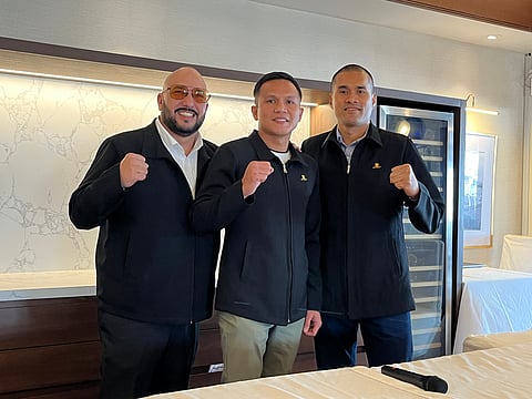 CHARLY Suarez (middle), trainer Delfin Boholst (right) and manager Ric Navalta are keeping their fingers crossed that the WBO rules are in their favor.