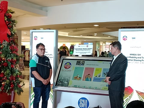 MMDA Chairman Romando Artes and Christian Mathay, regional operations head and senior vice president of SM Supermalls, launches traffic information project at SM Megamall, Wednesday afternoon, 17 December.