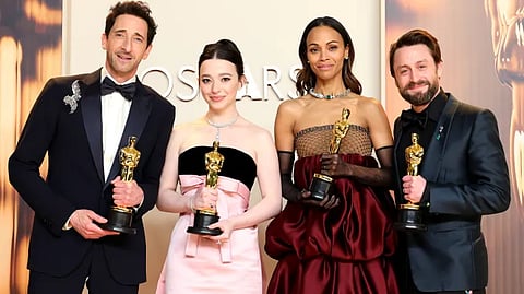 Adrien Brody, Mikey Madison, Zoe Saldaña, and Kieran Culkin pose with their Oscars backstage at the 97th Academy Awards, a quartet of winners marking the night’s defining performances. | Arturo Holmes