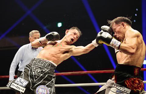 NONITO Donaire (left) gives Japanese defending champion Seiya Tsutsumi a taste of hell in their WBA bantamweight title fight on Wednesday night in Tokyo.