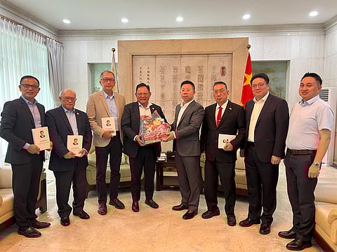 SEEN (from left) are APCU vice president Fernando Tiong, treasurer Gen. Ding Pace, immediate past president Sixto Benedicto, chairman and president Raul Lambino, Ambassador Jing, Ambassador Francis Chua, counsellor Ji and director Grey. 