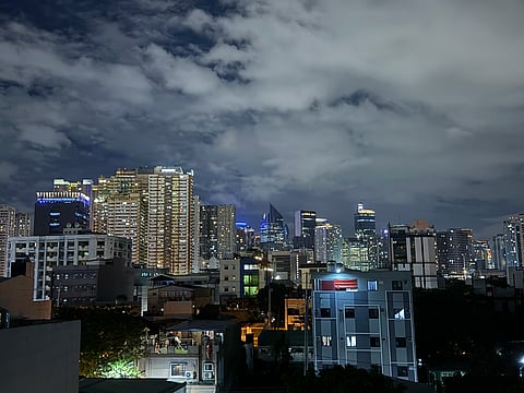 A CLOUDY sky covers Makati Central Business District Skyline at night, similar to the business expectations being clouded by the fallout from the flood control scandal.