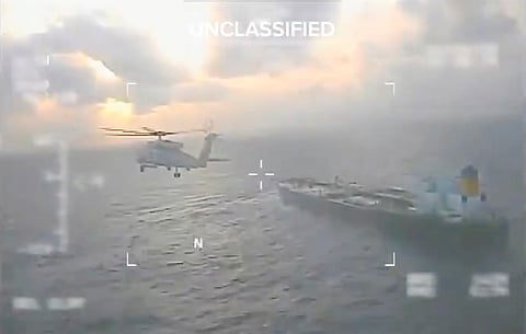 A UNITED States Coast Guard aircraft fly over a crude oil tanker, last docked in Venezuela, before apprehending it on 20 December 2025. 