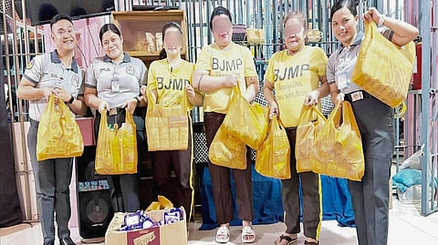 PDLs at the Parañaque City Jail Female Dormitory receive grocery packs from Solaire Cares.