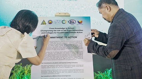 CHED chairperson Dr. Shirley C. Agrupis (left) and PASUC president Dr. Tirso A Ronquillo sign the Commitment to Action document during the Knowledge Exchange Forum at the GT-Toyota Asian Center Auditorium, UP-Diliman in Quezon City on 9 December.