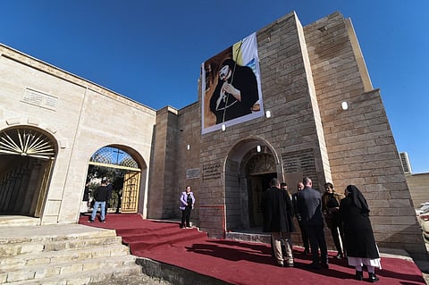 An image of Mar Oraha hangs as Christians attend the re-opening ceremony of the Mar Oraha Chaldean Monastery (Saint Abraham Monastery) following it's destruction by the Islamic State group (IS), in the Tal Keif district, close to the town of Batnaya, some 30 kilometers north of the Iraqi city of Mosul on December 18, 2025.
The northern city of Mosul and surrounding region was under the control of Islamic State group (IS) between 2014-2017, with Mosul being considered as the de facto capital of IS's self-declared "caliphate". Minority religious groups Christian and others were persecuted.