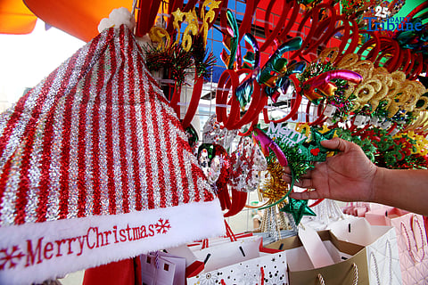 (December 23 2025) Customer looked at the colourful Christmas accessories to buy at Commonwealth Market in Quezon City, on Tuesday December 23 2025, two days before Christmas. Photo/Analy Labor
