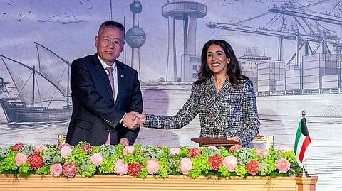 KUWAIT Minister of Public Works Nora al-Mashaan (right) and the deputy chairman of the China State Construction and Communications Corporation Limited, Chen Zhong, shake hands the signing ceremony for the study, design, and provision of pre-implementation services to complete the Mubarak Al-Kabeer Port on Boubyan island, north of Kuwait City on 22 December 2025.