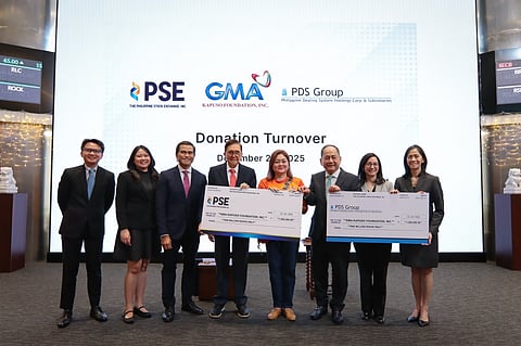HOLDING a ceremonial cheque each of their respective P1-million donation for communities hit by super typhoon ‘Uwan’ are (from left) PSE Capital Markets Development Division head Mark Frederick V. Visda, PSE Issuer Regulation Division head Atty. Marigel M. Baniqued-Garcia, PSE COO Atty. Roel A. Refran, PSE and PDS chairman Jose T. Pardo, GMAKF EVP and COO Rikki Escudero-Catibog, PSE and PDS president and CEO Ramon S. Monzon, Philippine Dealing & Exchange Corp. president Stephanie Marie A. Zulueta, and Philippine Depository & Trust Corp. president Ma. Theresa B. Ravalo.