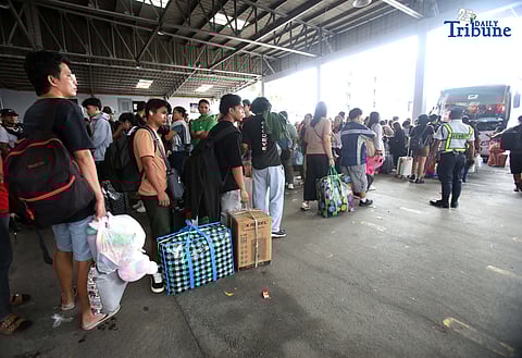 Passengers bound for their home provinces for the New Year were seen flocking to the JAC bus terminal in Quezon City on Friday, December 26, 2025.