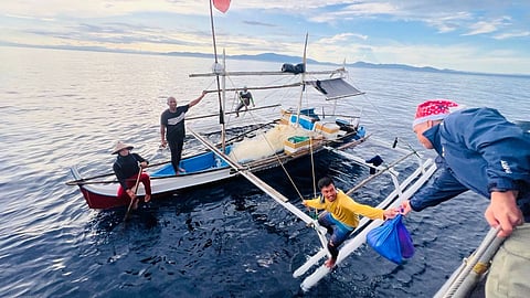 BRP Alberto Navarette (PC 394) personnel facilitated the distribution of food packs to the fisherfolk encountered during patrol operations. (Photo from Philippine Navy)
