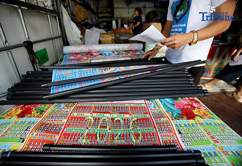 (December 27, 2025) Workers are busy preparing personalized calendars for 2026 orders from their customers at their shop along Commonwealth Avenue in Quezon City on Saturday, December 27 2025. Photo/Analy Labor