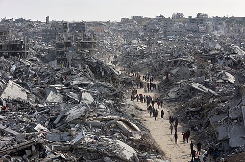 (FILES) This aerial view shows displaced Palestinians returning to the war-devastated Jabalia refugee camp in the northern Gaza Strip on January 19, 2025, shortly before a ceasefire deal in the war between Israel and the Palestinian militant group Hamas was implemented.
