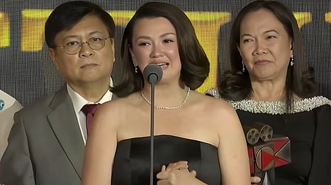 DIRECTOR Jeffrey Jeturian (left), lead star Angelica Panganiban (center) and filmmaker-celebrity lawyer Joji Alonso accept the Second Best Picture Award for ‘UnMarry.’
